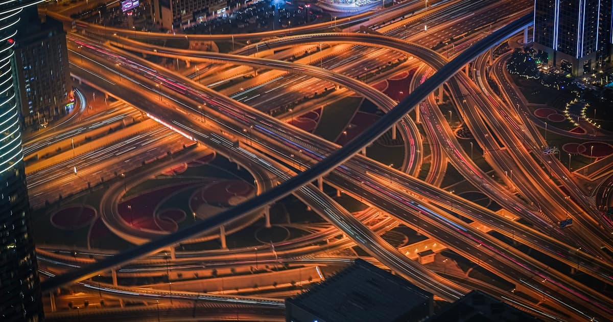 Highway interchange light trails at night along the US-Mexico trade corridor